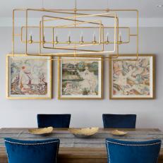 Glamorous Dining Room with Blue and Brass Details