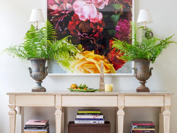 Bold and Colorful Floral Wall Art and Accessories Above a Table Bold and Colorful Floral Wall Art and Accessories Above a Table