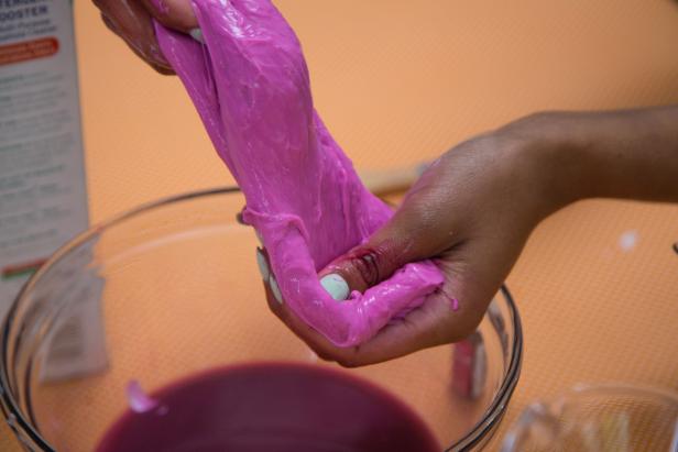 Knead the slime with your hands until it gets less sticky.