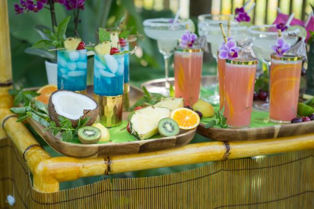 colorful drinks on a wood tray