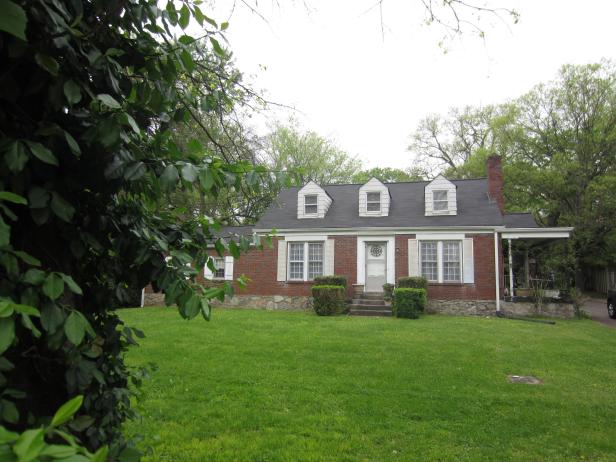 This Cape Cod meets Colonial style home in East Nashville, TN has a nice full brick front and windows with white shutters, giving the home a classic feel, as seen on House Hunters.