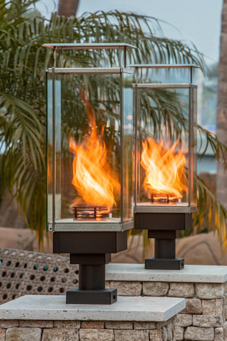 Sleek, Glass-Enclosed Fire Features outdoor space with contemporary fire features
