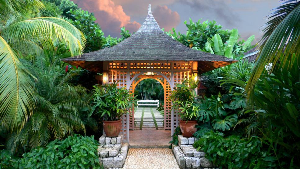 Pergola Offers Passage to Sitting Area tropical garden with wood pergola