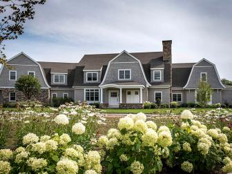 Gray Farmhouse With White Hydrangeas