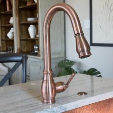 White Cottage Kitchen with Copper Faucet and Sink