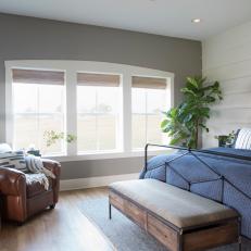 Neutral Contemporary Master Bedroom with Brown Leather Armchair 