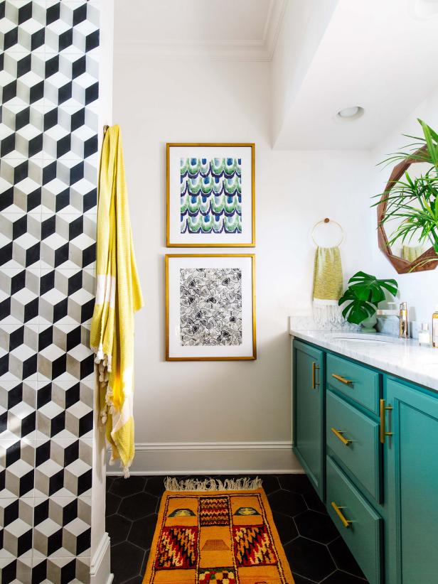 Small bathroom color palettes don't have be limited to whites and grays. In a small space, you can use bright, bold colors and patterns that might be overwhelming in a larger room. This small bathroom from Dabito of Old Brand New is bursting with rich colors, quirky patterns and geometric shapes.