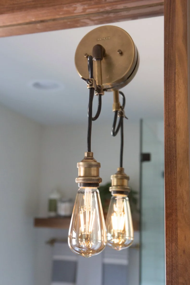 Black and White Master Bathroom with Edison Light Fixture 