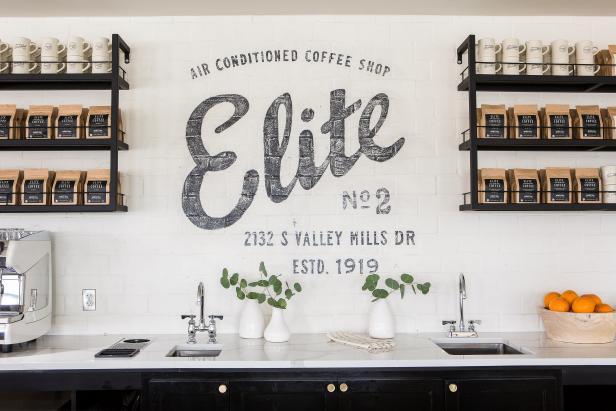 Black "Elite" Mural Behind Black Serving Bar