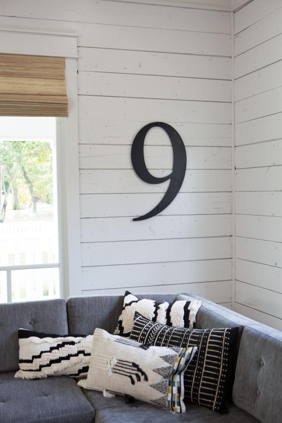 Rustic Black and White Living Room with White Shiplap Walls Black and White Living Room with White Shiplap Walls and Gray Sofa