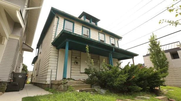 The original front exterior of duplex that Mina and Karen turned into two separate townhouses as seen on Good Bones 