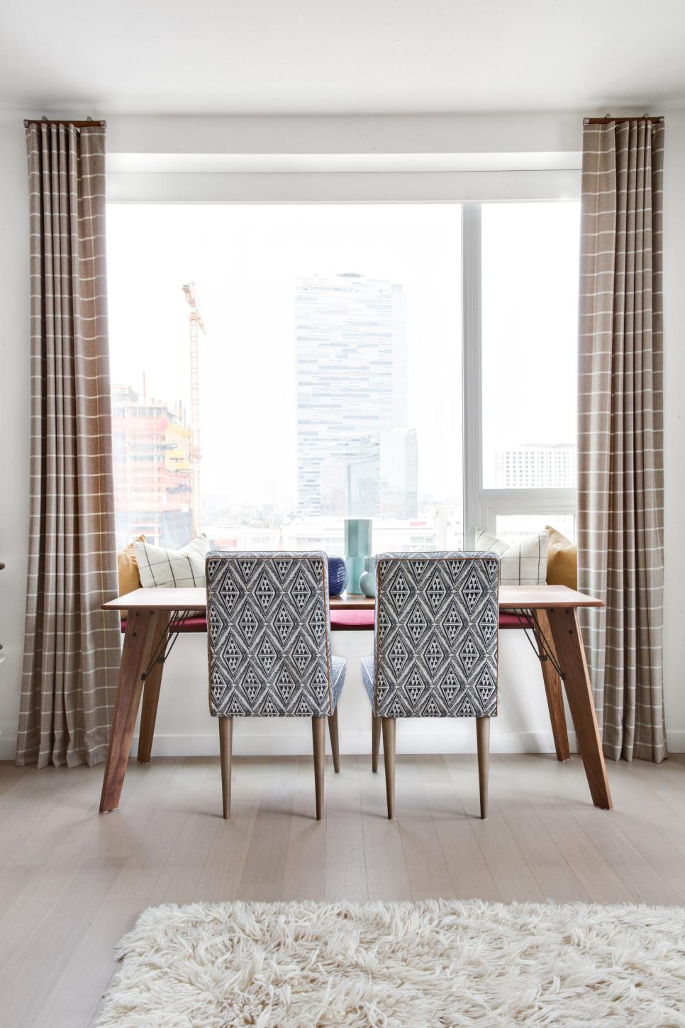 Small Midcentury-Modern Dining Nook View of Upholstered Dining Chairs at Wood Dining Table