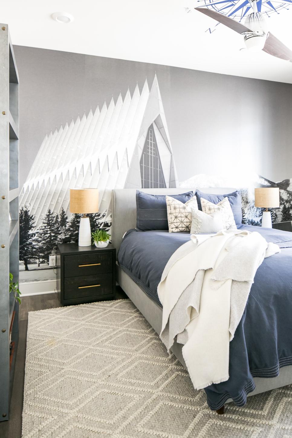 Cozy Bedroom with Accent Wall A cozy bedroom with an accent wall, upholstered headboard and rug.