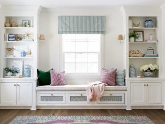 Pink-Striped Window Seat Between Bookcases