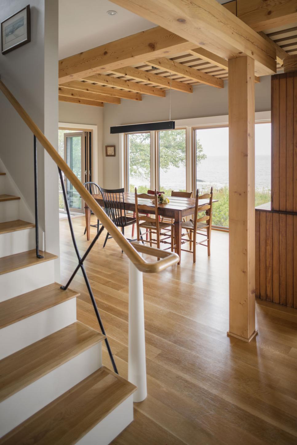 Cottage Dining Room With Natural Wood Table And Chairs And Exposed Rafters Cottage Dining Room With Mismatched Chairs And Traditional Table