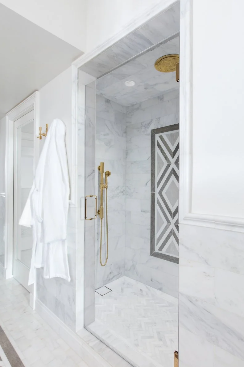 contemporary master bathroom with marble shower