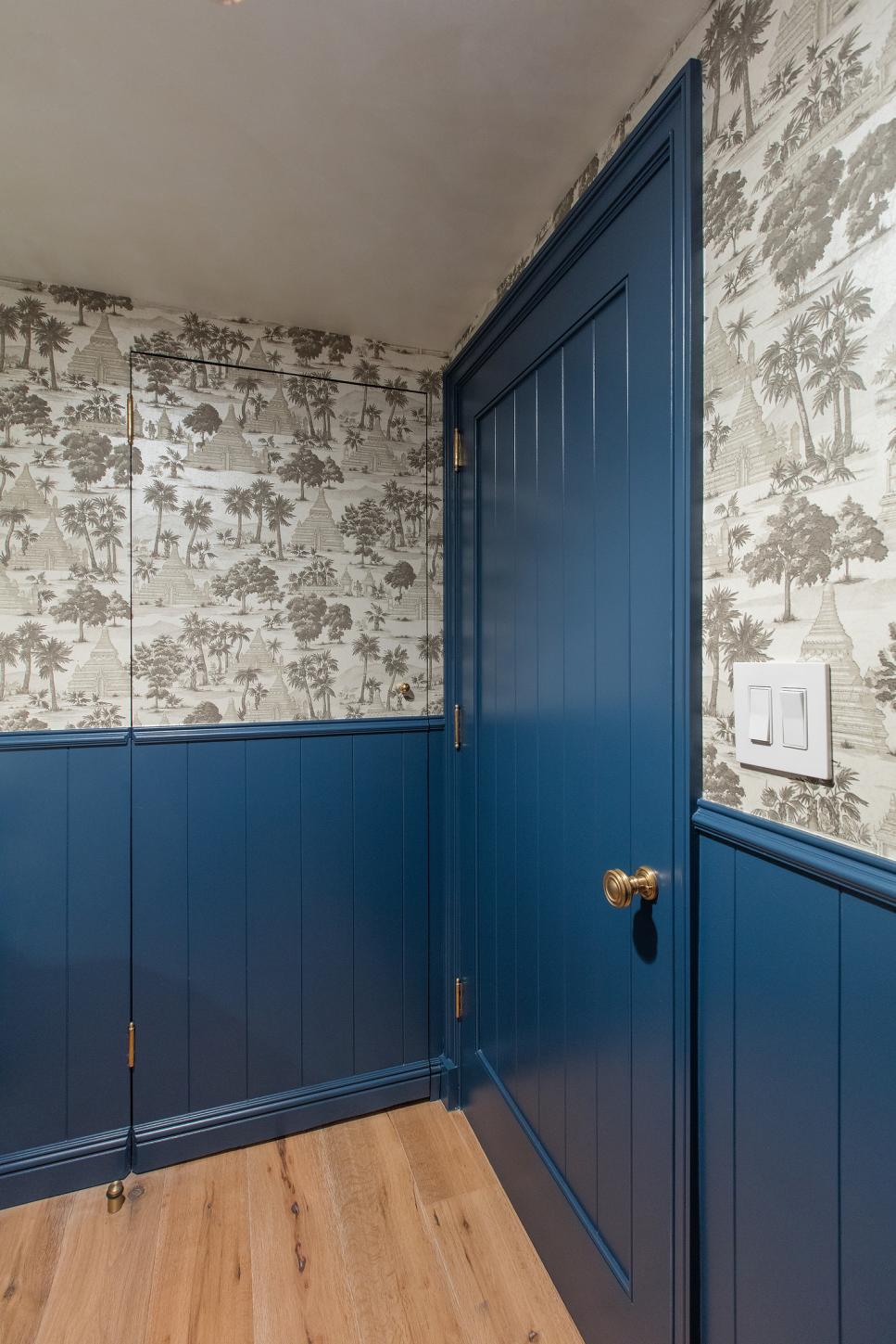 Blue Powder Room Features Patterned Wallpaper transitional blue powder room