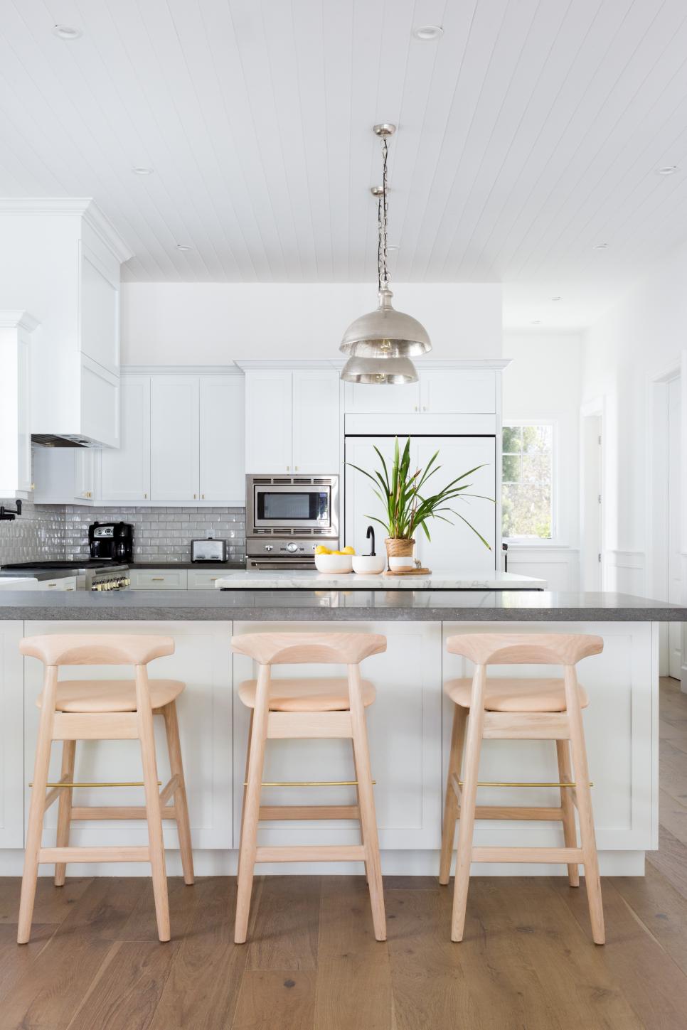 White and Gray Open Plan Kitchen With Wood Barstools White and Gray Open Plan Kitchen