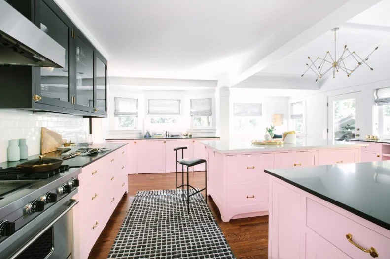 contemporary kitchen with pink and black cabinets