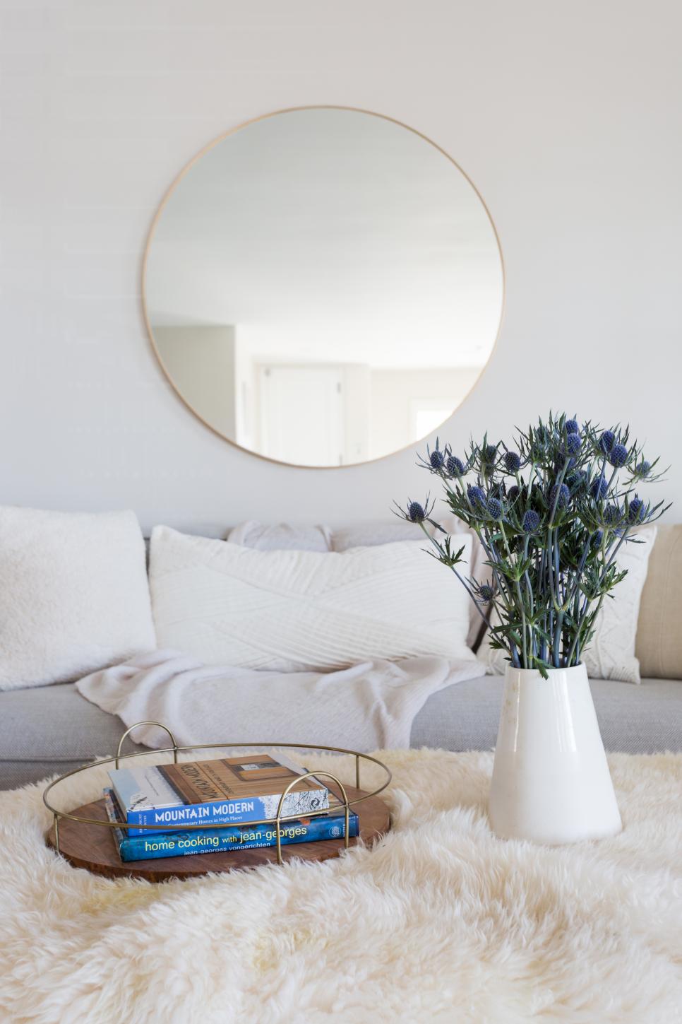 Contemporary Living Room Detail With White Upholstery And Accent Mirror Contemporary White Living Room With Neutral Accents And Modern Mirror