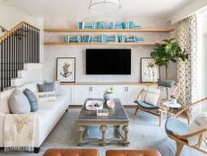 This coastal home, designed by Jennifer Mehditash, is a beautiful blue and white beachy escape. This home was voted the 2018 Faces of Design Awards overall winner and it's easy to see why.