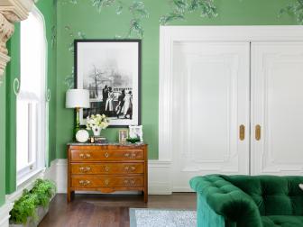 Traditional Elegant Living Room With Hand Painted Wallpaper And White Pocket Doors