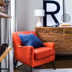 Industrial Bookshelf Meets Red Chair in Boys' Bedroom