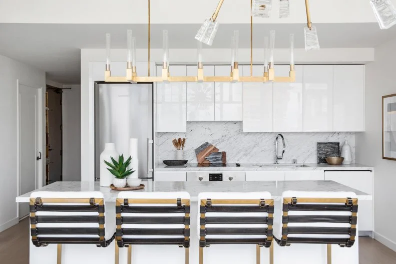 White Open Kitchen With Brass Lights
