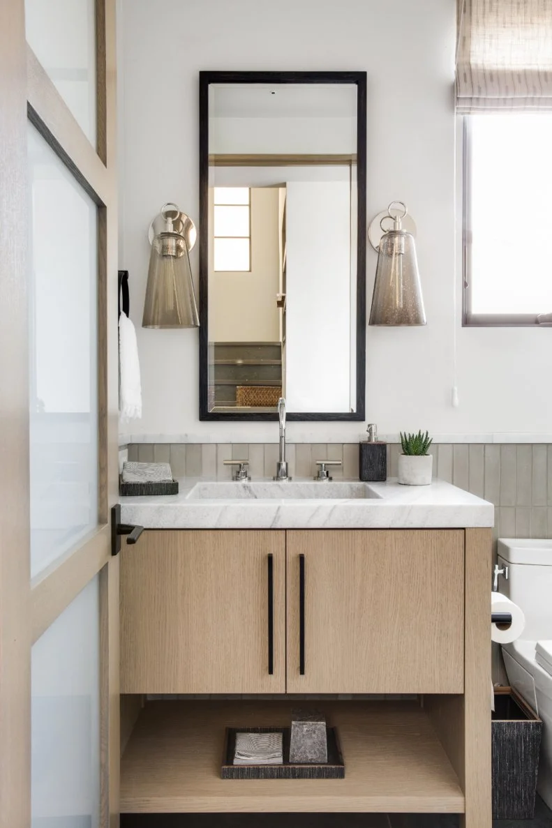 Powder Room With Gray Sconces