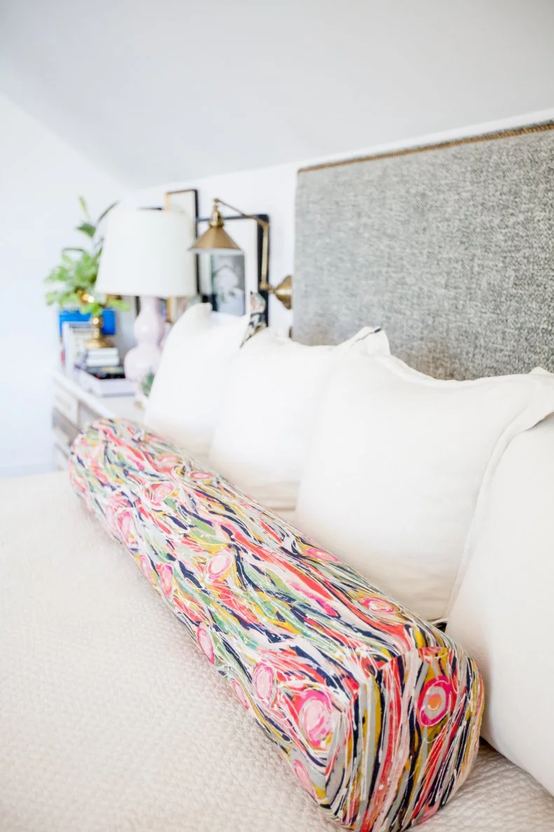 Multicolored Bolster Pillow Adds Color and Pattern to Bed