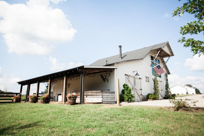 White Farmhouse Has Large Side Porch