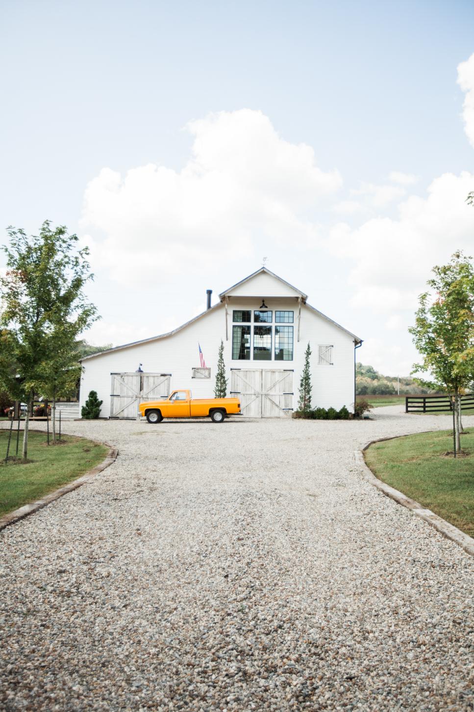 Gravel Driveway Leads to White Farmhouse Gravel Driveway Leads to White Farmhouse