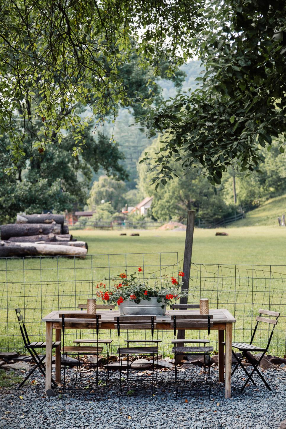 Wood Dining Set With View of Pastures country backyard with reclaimed wood table