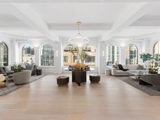 Large Great Room With Arched Windows and Coffered Ceiling