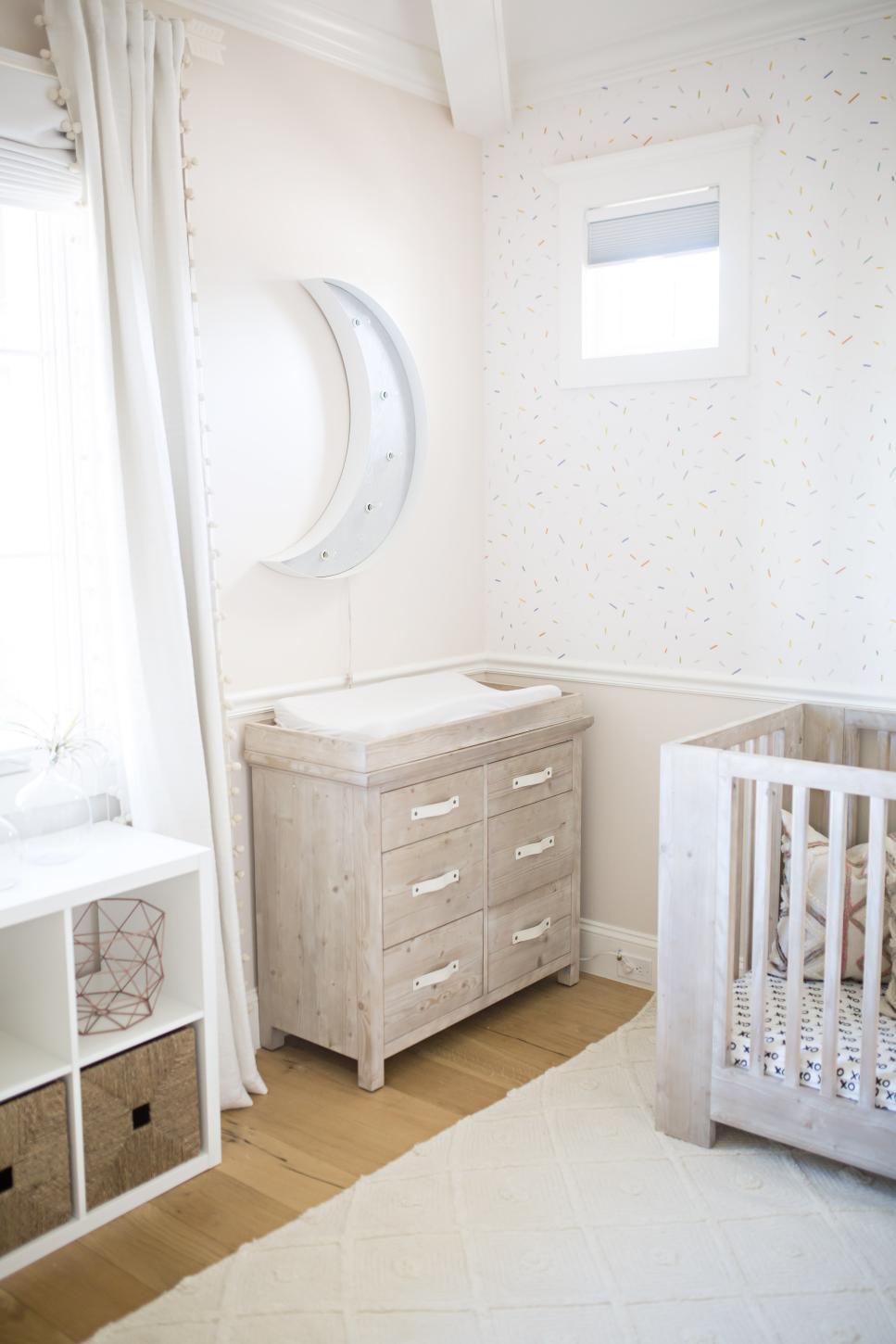 Wood Changing Table Complements Crib in Neutral Girl's Nursery transitional nursery with wood changing station