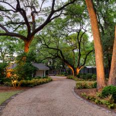 Traditional Southern Wooded Garden With Gravel Path And Pavers