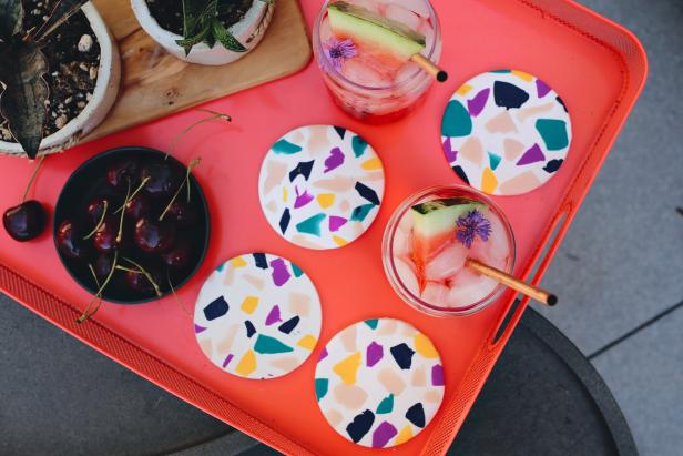Terrazzo is popping up everywhere these days. From chic kitchen backsplashes to trendy tabletop decor, this multicolored marble look is the confetti of the design world. Where covering your home with this material can be costly, we’re going to celebrate this style on a budget with DIY drink coasters that are perfect for summer entertaining. Cheers!