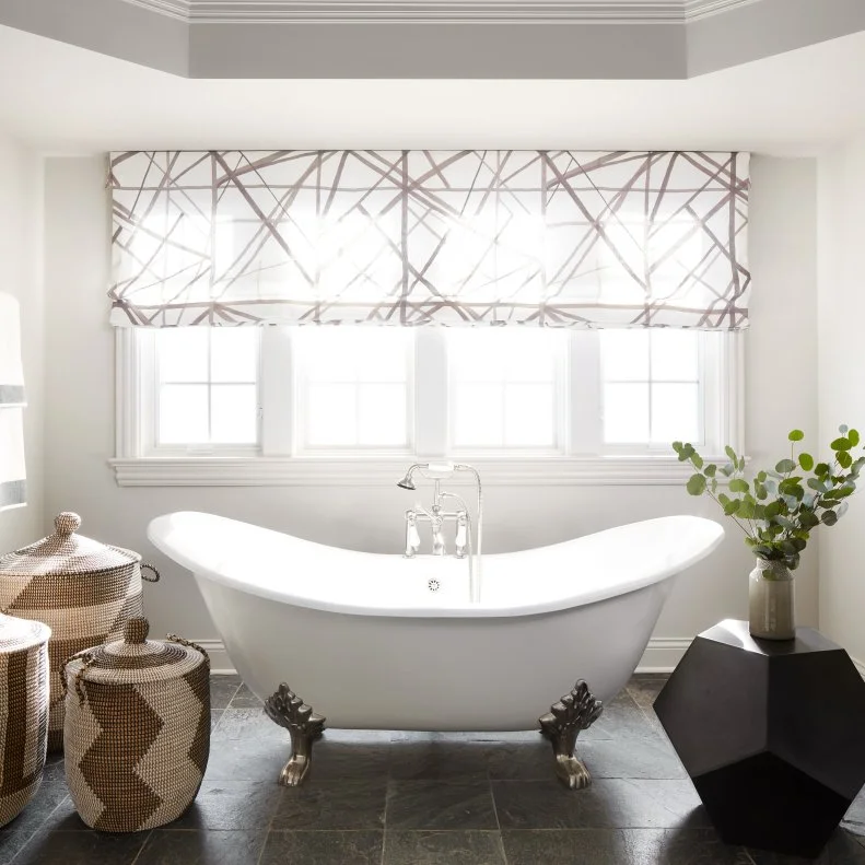 transitional master bathroom with clawfoot tub