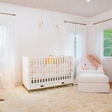 Neutral Contemporary Nursery With Pink Throw