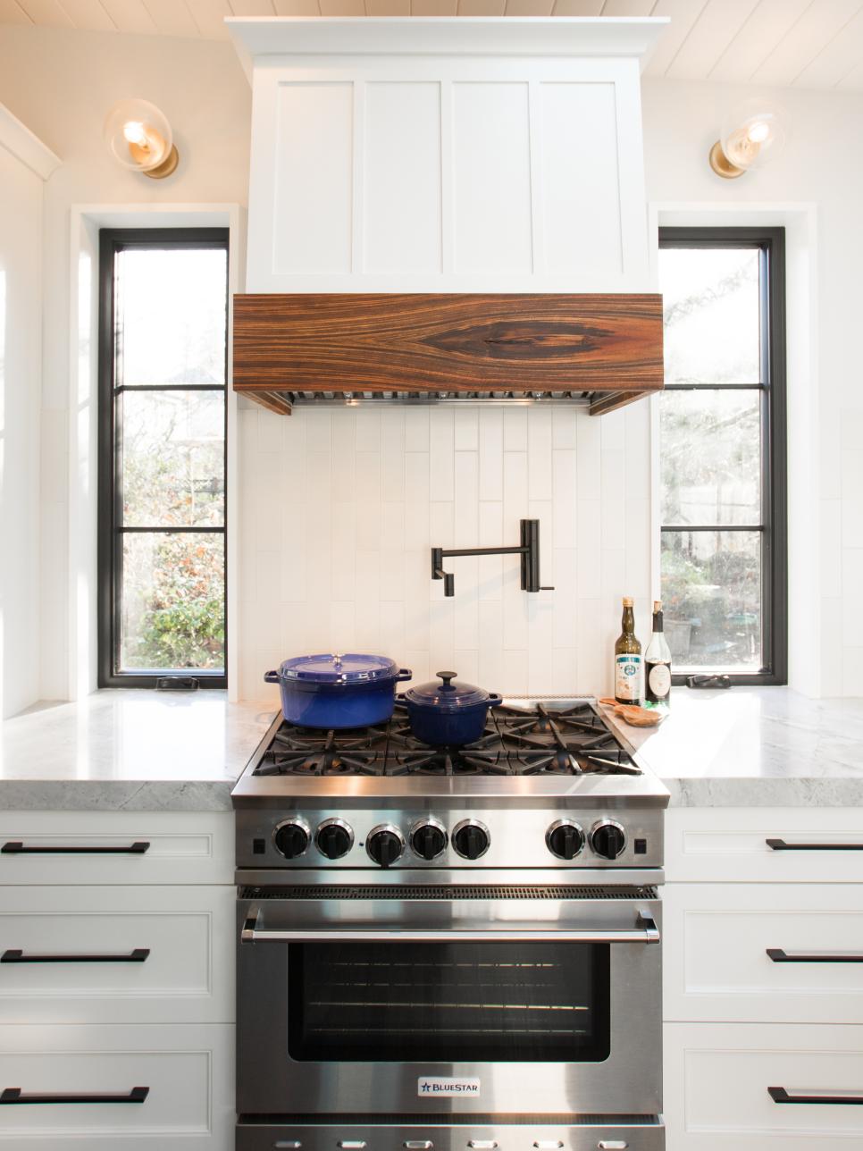 Stainless Steel Oven and White Range Hood Range Hood and Oven