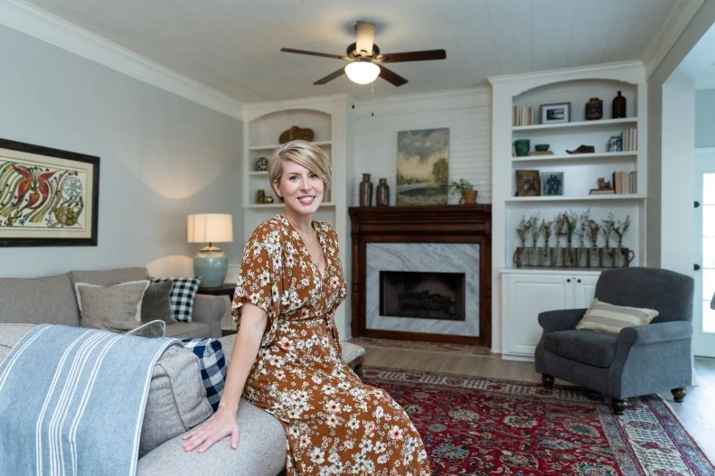 As seen on Home Town, Ben and Erin (C) Napier have fully renovated the Hogue Residence in Laurel, Mississippi.  The large den area has been updated with a new fireplace mantle and warmer paint colors to create a relaxing mood. (portrait)