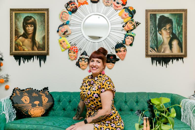 Jennifer Perkins Posing On Couch in Home Decorated for Halloween