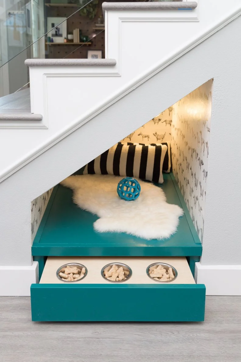 Nothing says "custom" like home design that reflects the priorities of the people (and pets!) who live there. Here, Jasmine Roth (a dog lover herself) carved out a sweet spot for Fido under the staircase.