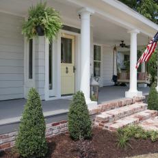 Front Porch With Columns, Flag and Handmade Swing