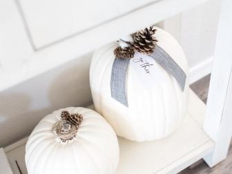 Pretty up plain white faux pumpkins by adding ribbon, embellishments like cotton blossoms and pinecones and our cute printable “gather” tag.