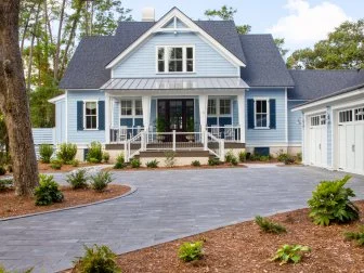 Since the placement of this house encourages low light with indirect sunlight throughout the front yard, a selection of plants were used that favor this type of environment. The plants were strategically placed to welcome the beauty and relaxed style of the Lowcountry.