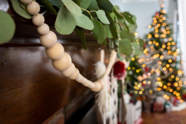 Close Up of Wooden Bead Garland Hanging From Mantel