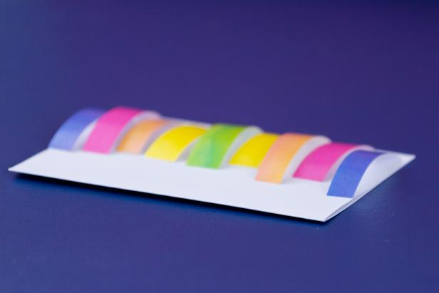 Cut small rectangles of various heights out of colorful wrapping paper. Arrange them on the bottom of your card.