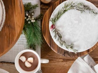 Overhead Photo of a Rustic Table Setting With a Frosted Cake and Deer-Inspired Utensils