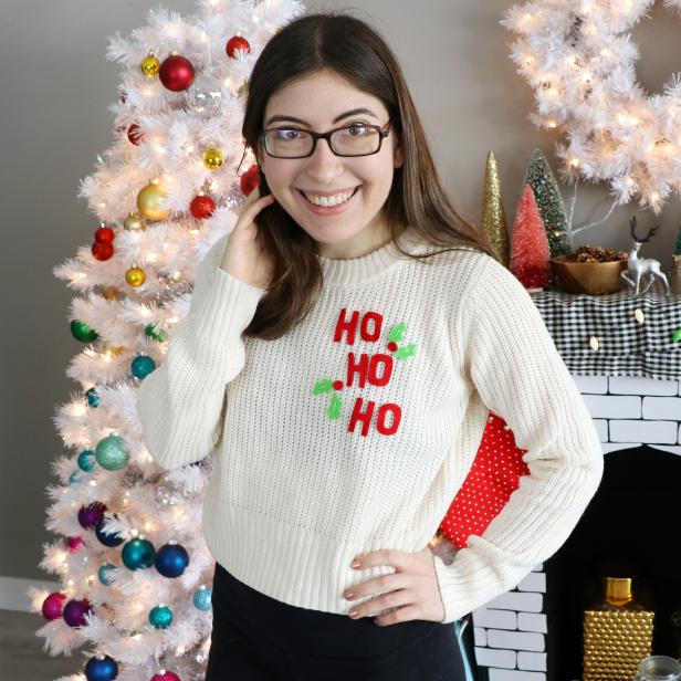 Woman Wearing Sweater That Says "Ho Ho Ho"